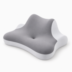 Gray wedge neck support pillow angled view showing white side panels and central cradle